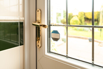 Shallow focus of a newly installed double glazed kitchen door, looking out to the large private...