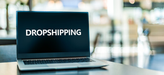 Laptop computer displaying the sign of Drop shipping