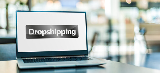Laptop computer displaying the sign of Drop shipping - 791814054