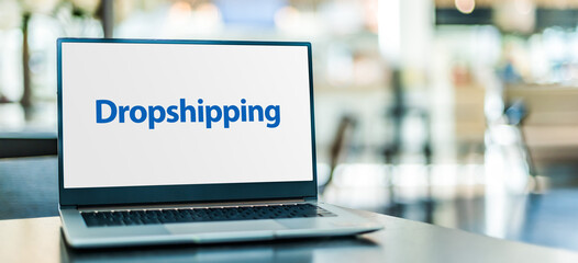 Laptop computer displaying the sign of Drop shipping - 791814057