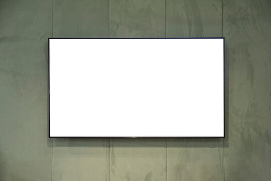 large flat screen TV mounted on a fabric wall