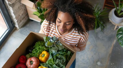 excited woman unpacking fresh organic vegetables from delivery box healthy eating lifestyle high angle view - Powered by Adobe