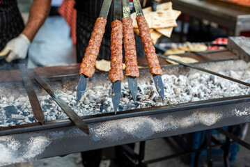 Delicious Adana kebabs on a bbq in the traditional orange blossom festival in Adana city, close up
