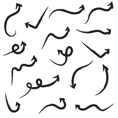 Obraz premium Black hand-drawn brush stroke arrow isolated on a white background.
