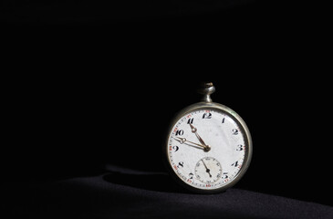 Old silver pocket watch isolated on black background. Time concept, antique object - 791826232