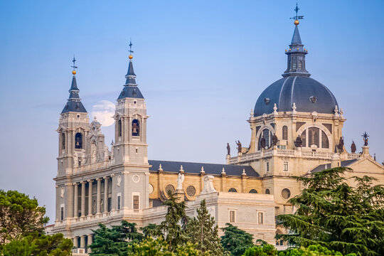 Sunset image of the Almudena Cathedral in Madrid with the full moon in the background