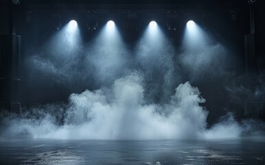 A stage with four lights and a lot of smoke. The smoke is coming from a fog machine