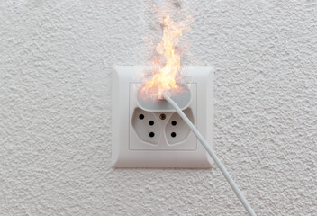 Socket or wire plug malfunction burning phone charger in indoor, electric short circuit causing...