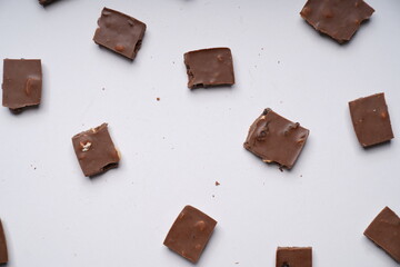 chocolate pieces on a white background