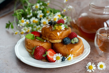 Breakfast pancakes with berries and chamomile tea. 