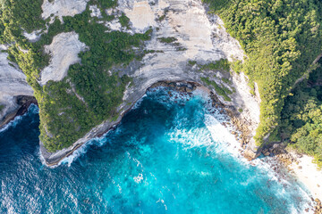 Sea, rocky mountains covered with forest. Big stones in water. Vacation. Klungkung. Bali Indonesia.