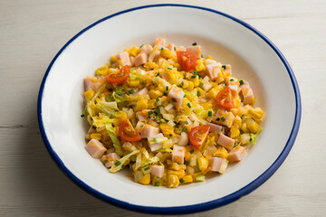 Turkey, corn, cabbage and mayonnaise salad. Traditional salad recipe for summer.