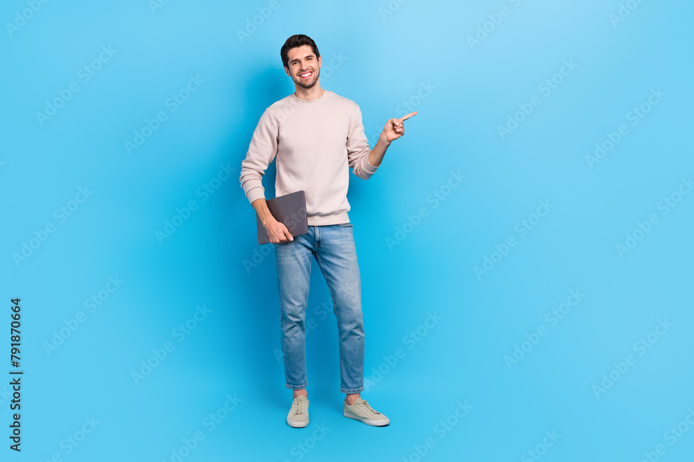 Poster full size photo of optimistic man wear sweatshirt hold laptop directing at business offer empty spac