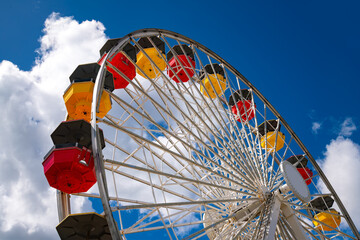 Colorful ferris wheel on the pier at Santa Monica Beach, LA California (USA). Yellow and red...