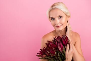 Photo of adorable lovely nude lady hold fresh blooming wildflowers touch neck empty space beauty promo isolated on pink color background - 791877229