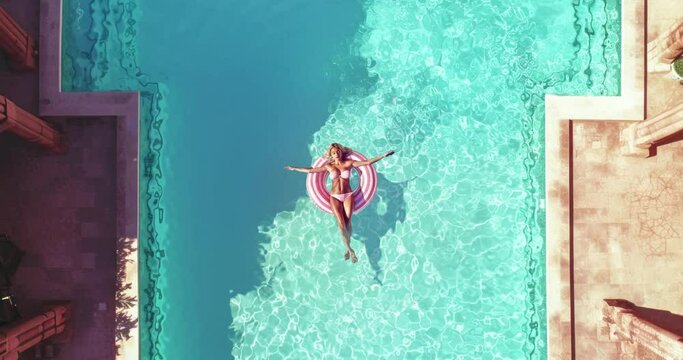 4k collage animation. Lady chilling in the pool. Ideal intro for music