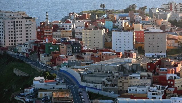 Side panning with close up view of the city of Ceuta at sunset