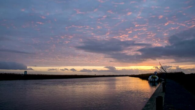 4k timelapse at sunset over the River Waveney at Herringfleet, Suffolk, UK