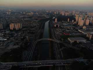 Incredible sunset in the city of São Paulo, a megalopolis with an aerial image above the Tietê...
