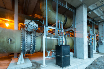 Water pipes and pumps at a reverse osmosis desalination plant. - obrazy, fototapety, plakaty