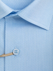 Close-up of a button placket on a light blue diamond shaped mesh shirt