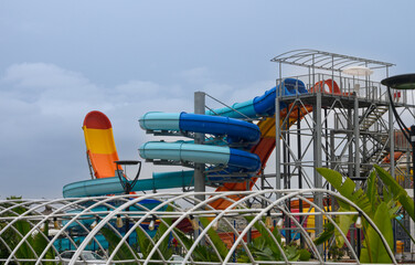 Water park, bright multi-colored slides with a pool. 2
