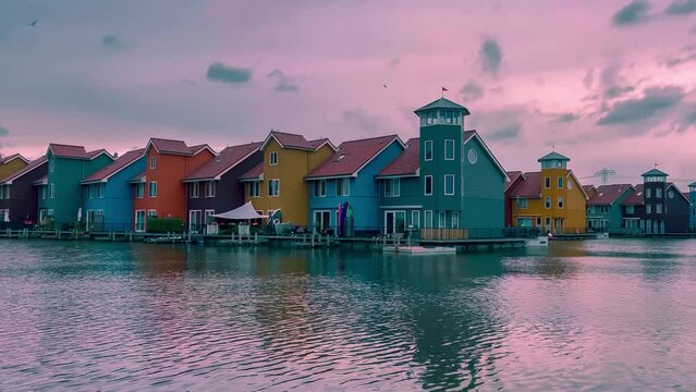 Traditional Dutch architecture of old houses and pier in historical center of Groningen, the Netherlands August 20, 2023. High quality 4k footage