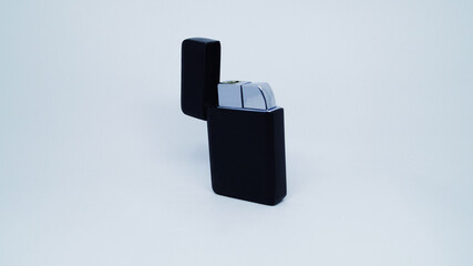 Black cigarette lighter on white background