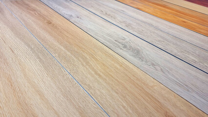 chart color of spc vinyl flooring tiles plank sample showing multi color and texture of wood, close up view. wood texture for flooring and interior design. production of wooden floor materials.