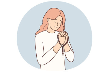 Religious woman pray with rosary