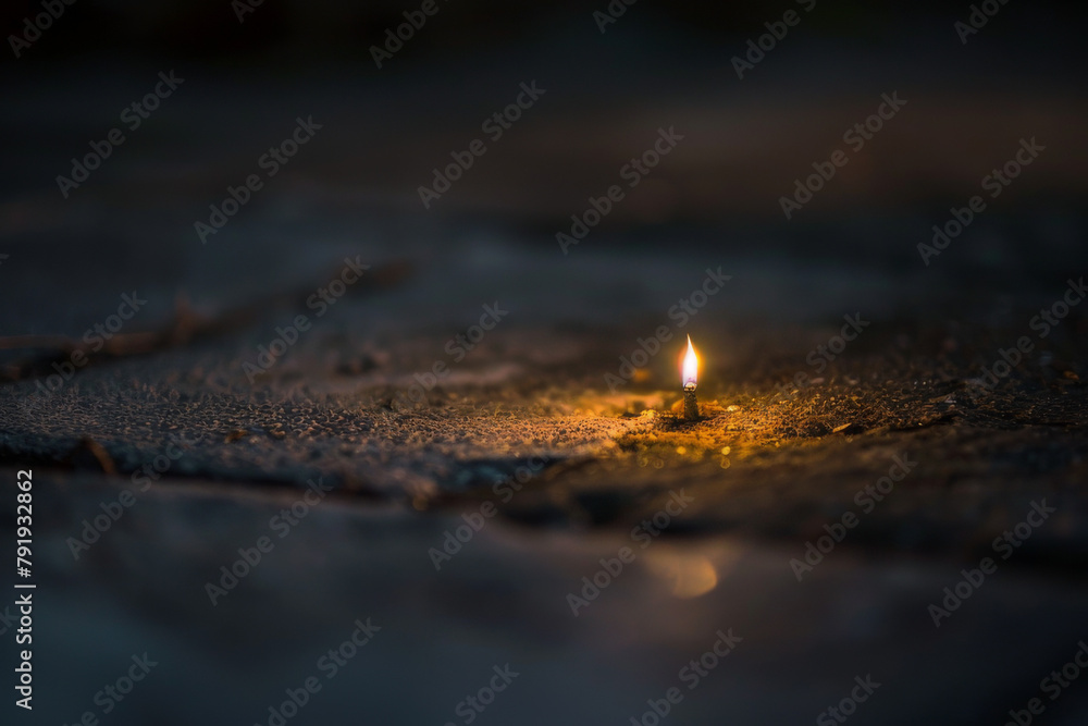 Canvas Prints the struggle of a small, fragile light surrounded by overwhelming darkness, symbolizing hope or posi