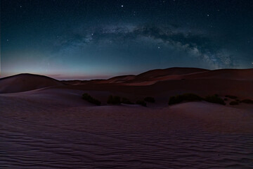 The full Milky Way arch panorama over the Abu Dhabi Desert dunes