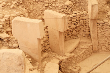 A few of the pillars in enclosure D at the neolithic archaeological site of Göbekli Tepe, Potbelly Hill, Pillar 33 seen in the middle shows two cranes, close to Sanliurfa, Turkey © Anja