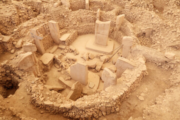 Enclosure C at the neolithic archaeological site of Göbekli Tepe, Potbelly Hill, central pillar 37 with a fox on it and pillar 27 with a cat chasing a boar clearly visible, close to Sanliurfa, Turkey © Anja