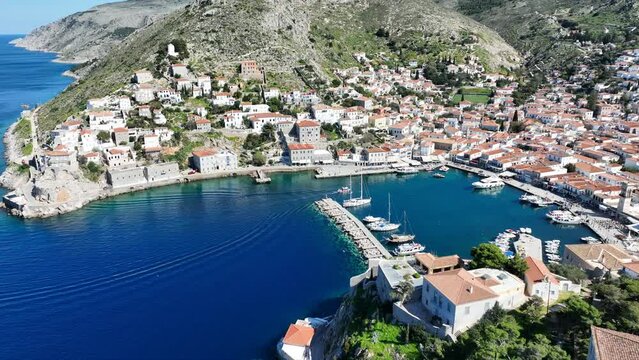 Aerial drone cinematic video of picturesque and historic main village of Hydra or Ydra island well know for captain's mansions and marine tradition, Saronic gulf, Greece