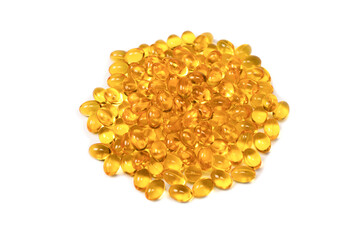 A group of yellow capsules isolated on a white background. - obrazy, fototapety, plakaty
