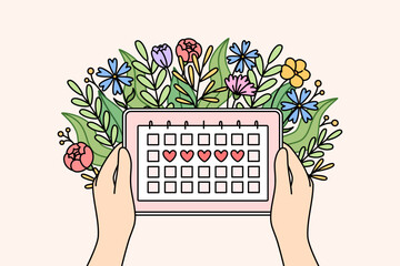 Menstrual cycle calendar in hands of woman and flowers, for design of gynecological products for girl or calculation of PMS. Women health concept and tracking menstrual or PMS days