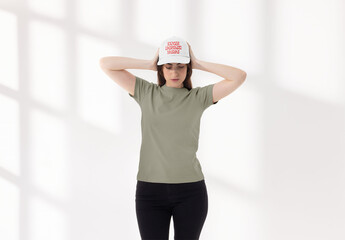 Mockup of woman wearing customizable baseball cap in studio - obrazy, fototapety, plakaty