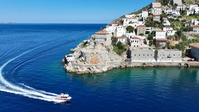 Aerial drone cinematic video of picturesque and historic main village of Hydra or Ydra island well know for captain's mansions and marine tradition, Saronic gulf, Greece