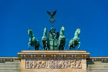 The quadriga at the top of Brandenburg Gate in Berlin, Germany - obrazy, fototapety, plakaty
