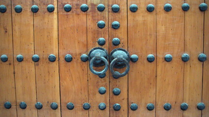 Handle on the wooden doors of a mosque in Fes, Morocco