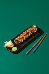 An exquisite Unagi roll, topped with Tobiko caviar and packed with shrimp, elegantly presented on a...