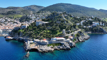 Aerial drone photo of famous small seaside swimming area of Hydroneta next to main village of Hydra island, Saronic gulf, Greece - obrazy, fototapety, plakaty