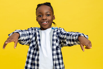 Smiling african american boy in checkered shirt looking happy
