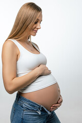 Long-haired woman pregnant woman with a big belly