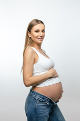 Long-haired woman pregnant woman with a big belly