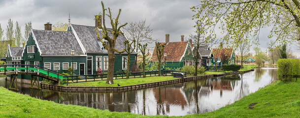 Zaanse Schans, typical traditional houses next to the canal, Zaanstad Municipality, European Route of Industrial Heritage, Netherlands - Powered by Adobe