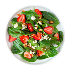 Summer salad of spinach, strawberries and blue cheese in a white plate isolated on a white background