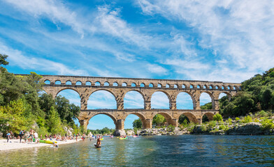 Fototapeta na wymiar The Pont du Gard is an ancient Roman aqueduct, that is depicted on five euro note. Summer 2022.