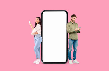 Two Multiracial people next to giant smartphone